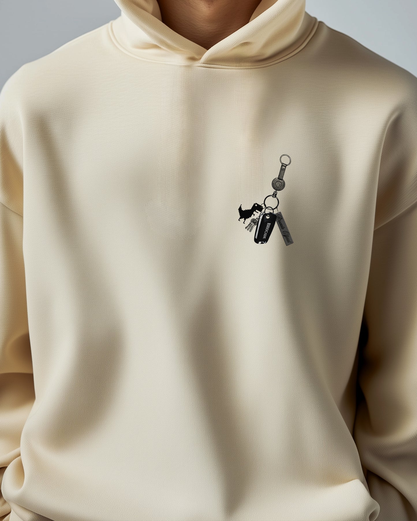 BEIGE DINO KEY ESSENCE HOODIE