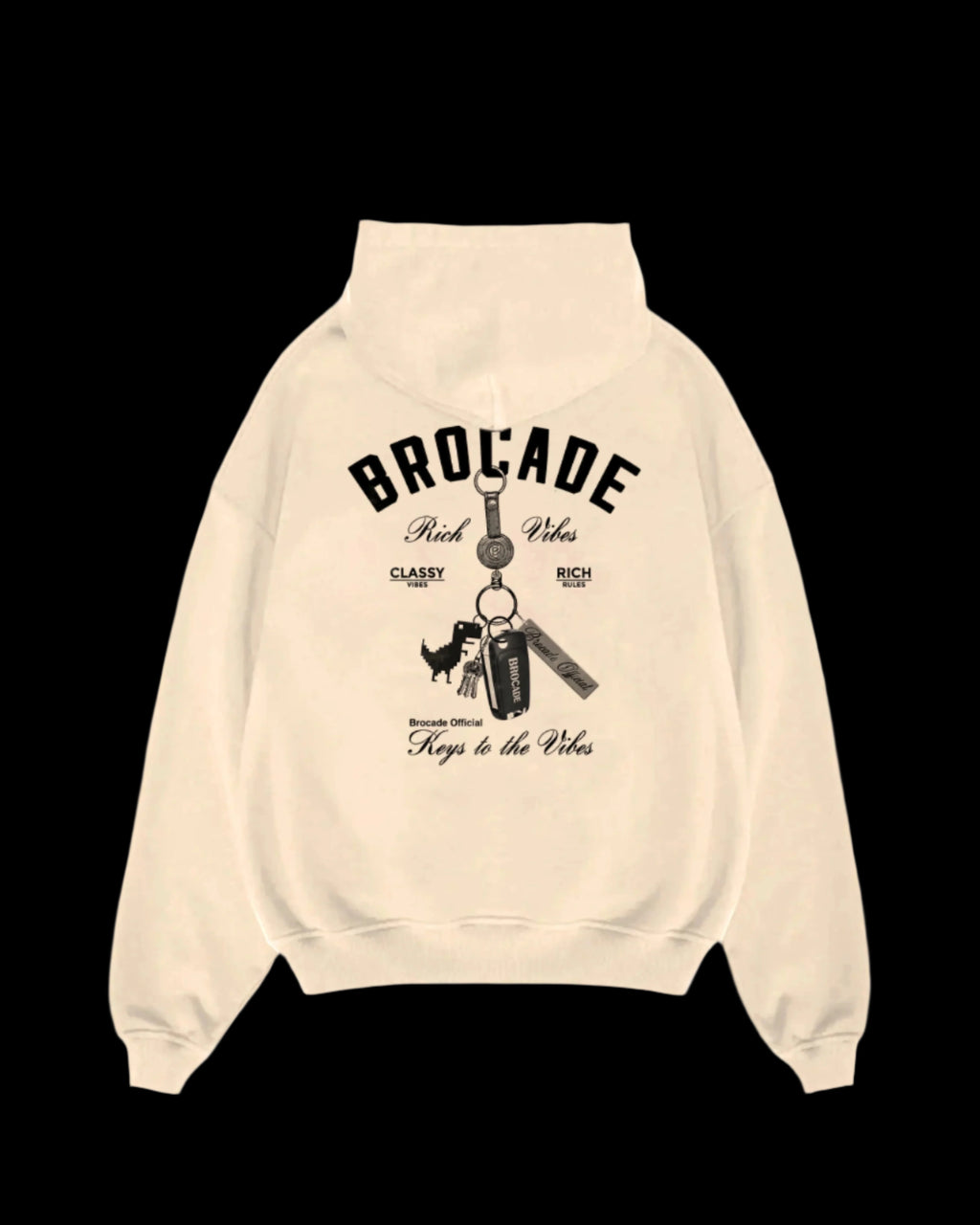 Beige hoodie with 'BROCADE' branding and graphic of a dinosaur on a keychain, along with text elements such as 'KEYS TO THE VIBES' and 'TAKE A TRIP TO THE BEACH'.